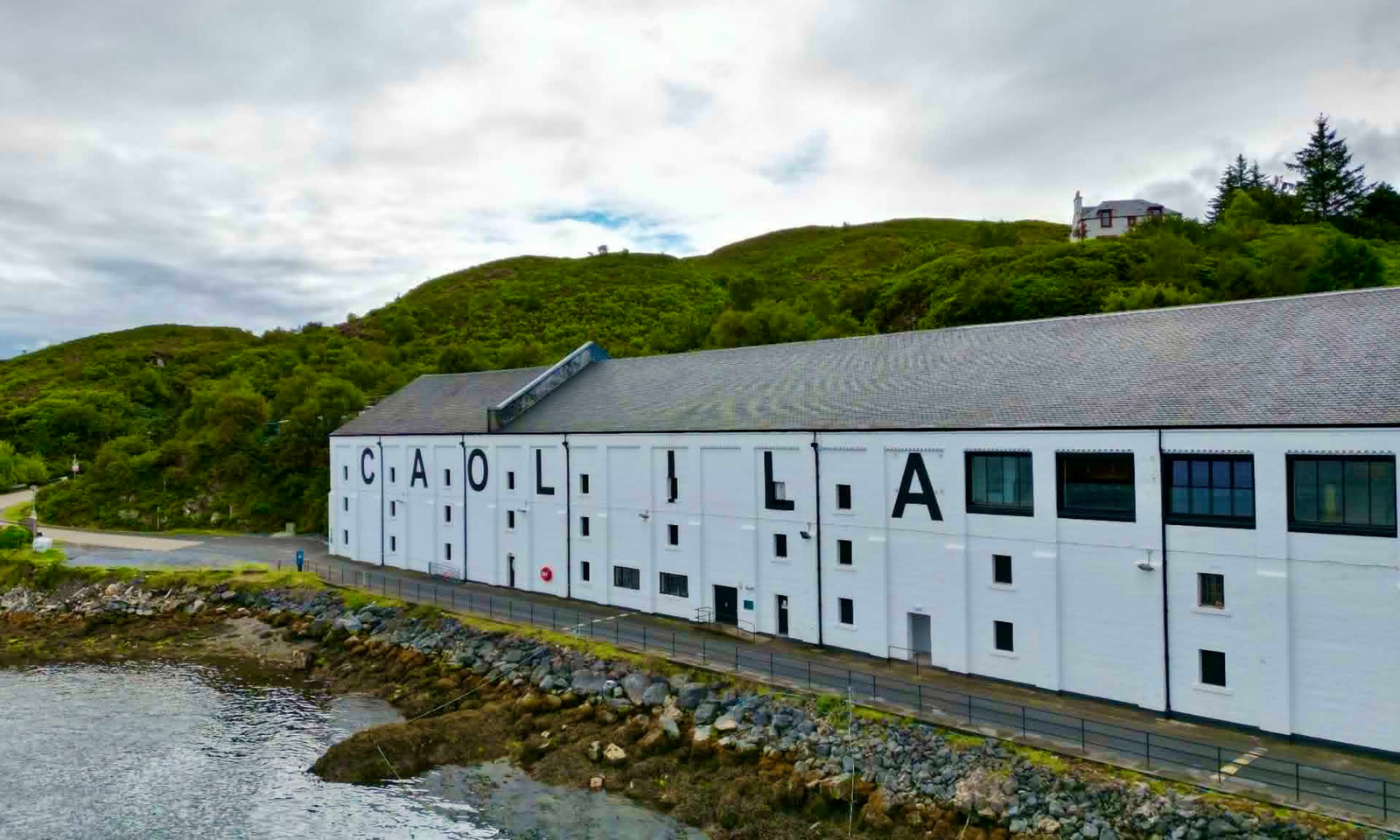 Caol Ila Distillery on the Sound of Islay Caol Ila Distillery's whitewashed warehouse beside the Sound of Islay