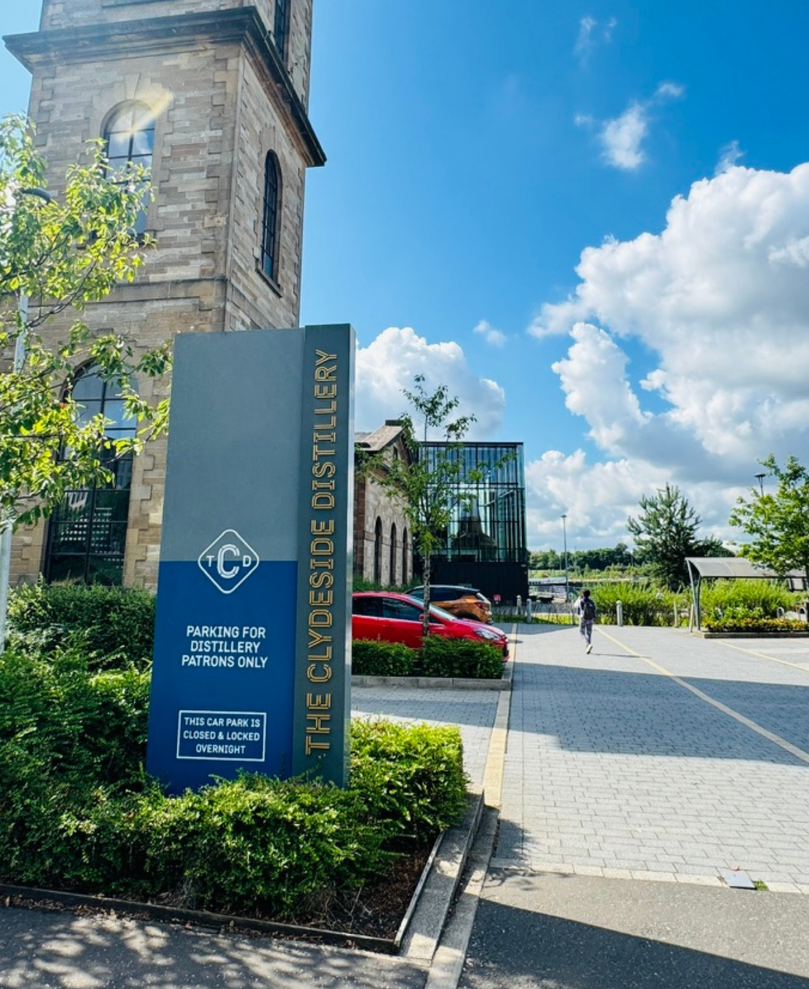 The Clydeside Distillery Entrance sign for The Clydeside Distillery in Glasgow, with the converted pump house building and modern glass extension behind
