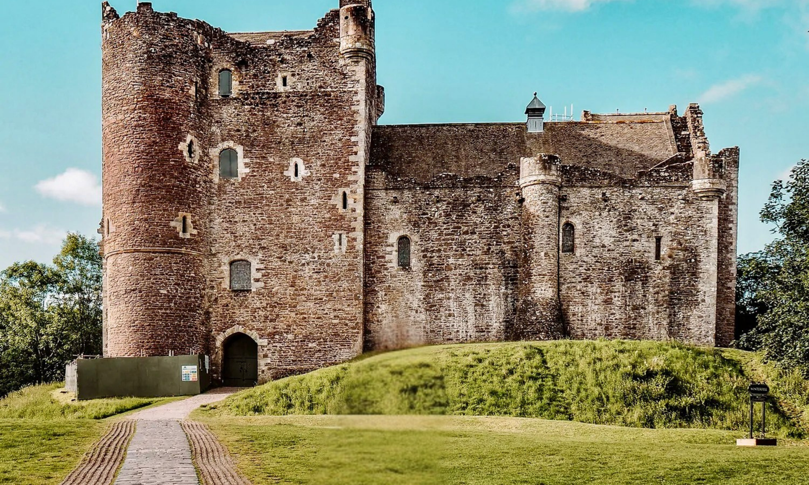 Doune castle Doune Castle's stone keep and courtyard, set on a grassy mound with a cobbled path leading to the entrance
