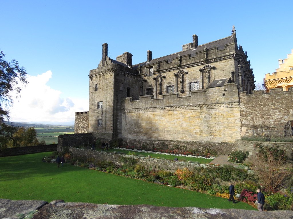 stirling-castle-gardens.jpg Stirling Castle exterior with terraced gardens and countryside view under an overcast sky