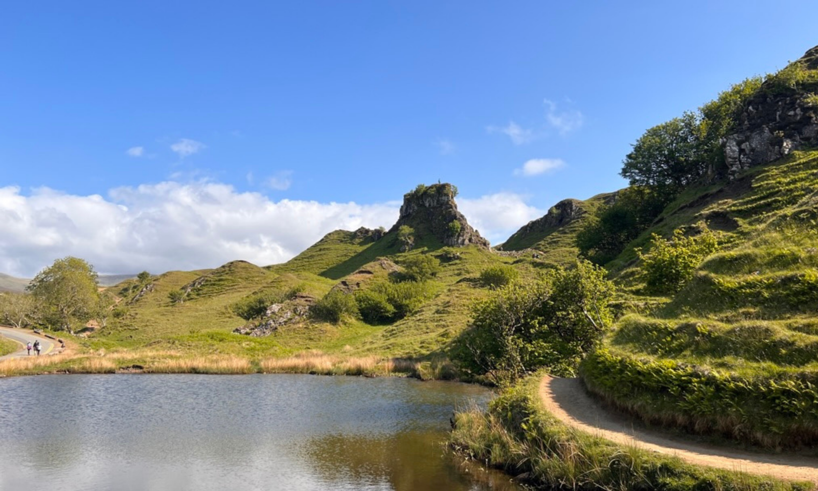 Fairy Glen, Isle of Skye Fairy Glen's Castle Ewen rock formation rising above a loch on the Isle of Skye, Scotland