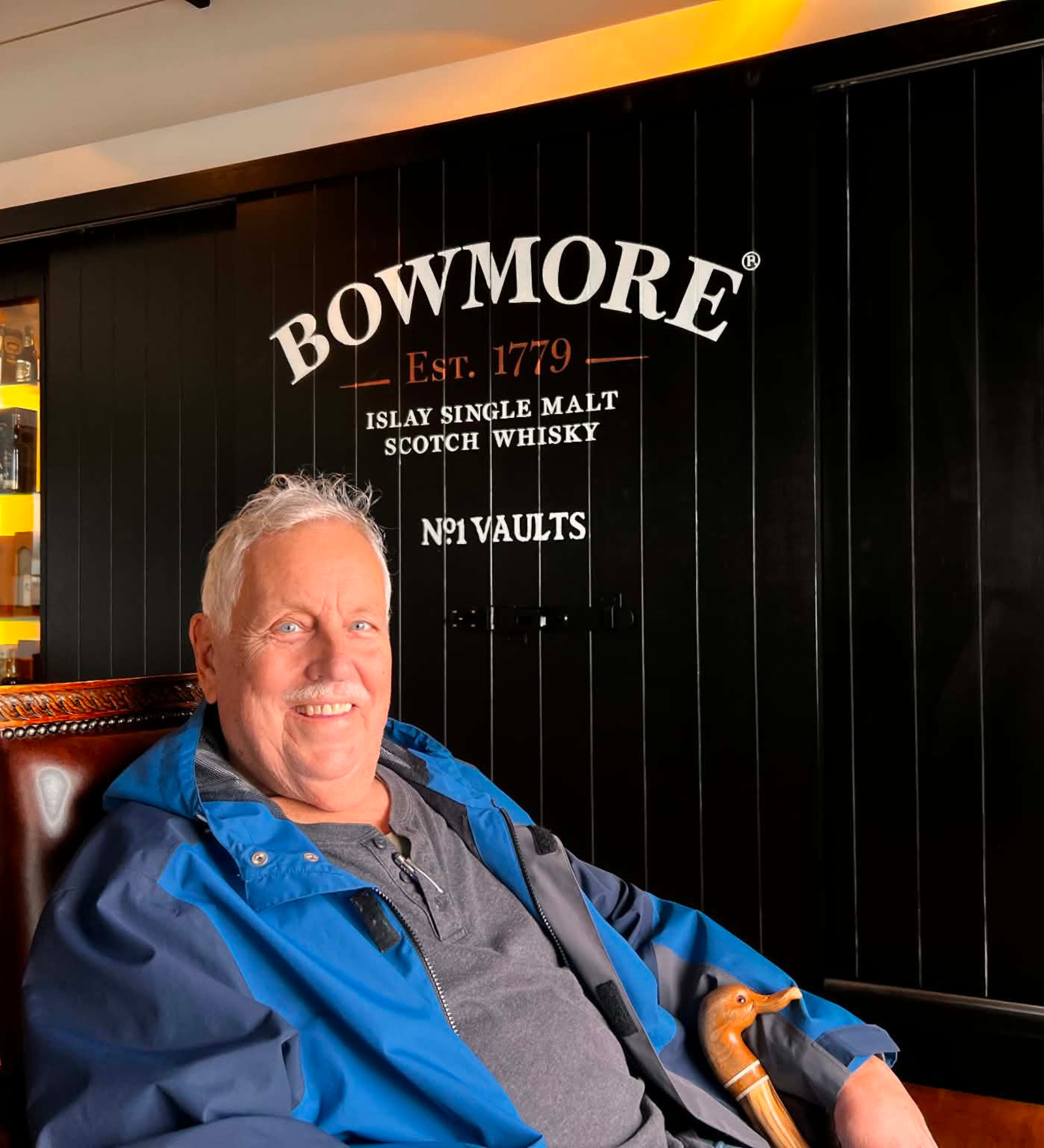 Guest at Bowmore Distillery's No.1 Vaults, Islay Guest relaxing at Bowmore Distillery's No.1 Vaults on Islay