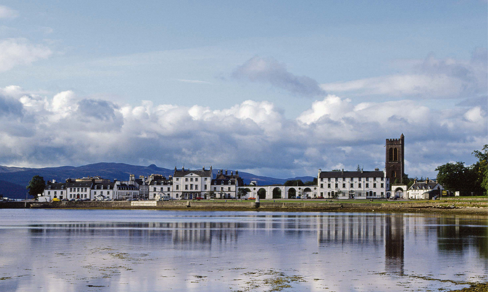 Inveraray The whitewashed waterfront town of Inveraray reflected in Loch Fyne, with its clock tower and hills behind