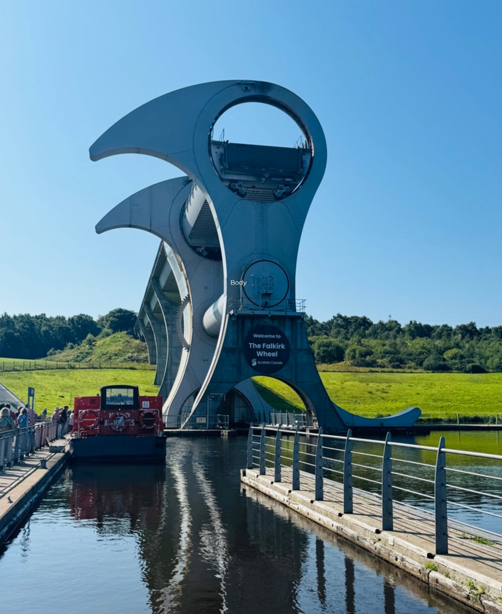 The Falkirk Wheel The Falkirk Wheel rotating boat lift, with a canal boat passing through the canal basin below