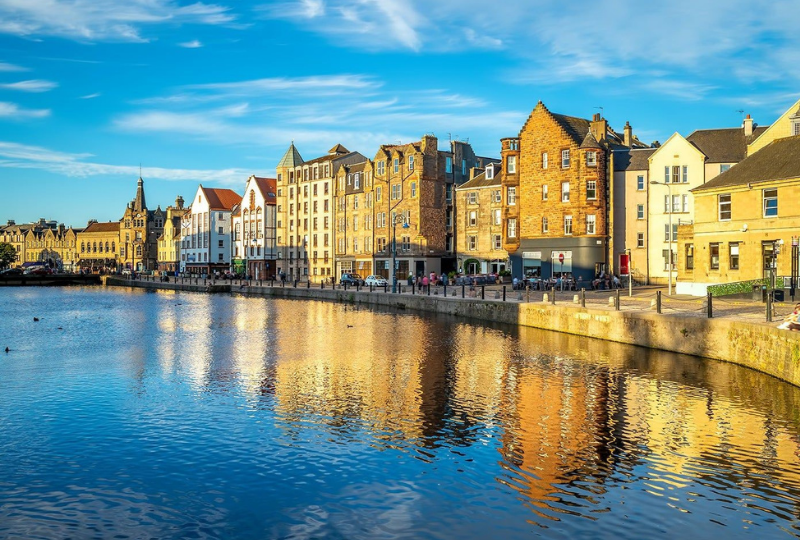 Water of Leith Historic waterfront buildings reflected in the Water of Leith at golden hour, Edinburgh