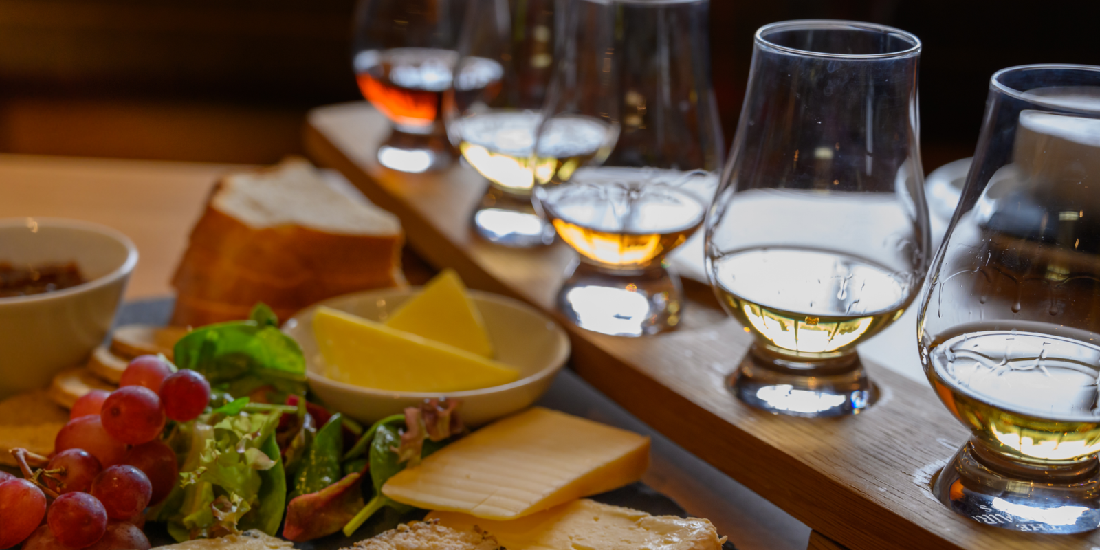 Whisky tasting flight paired with Scottish cheese, bread and grapes