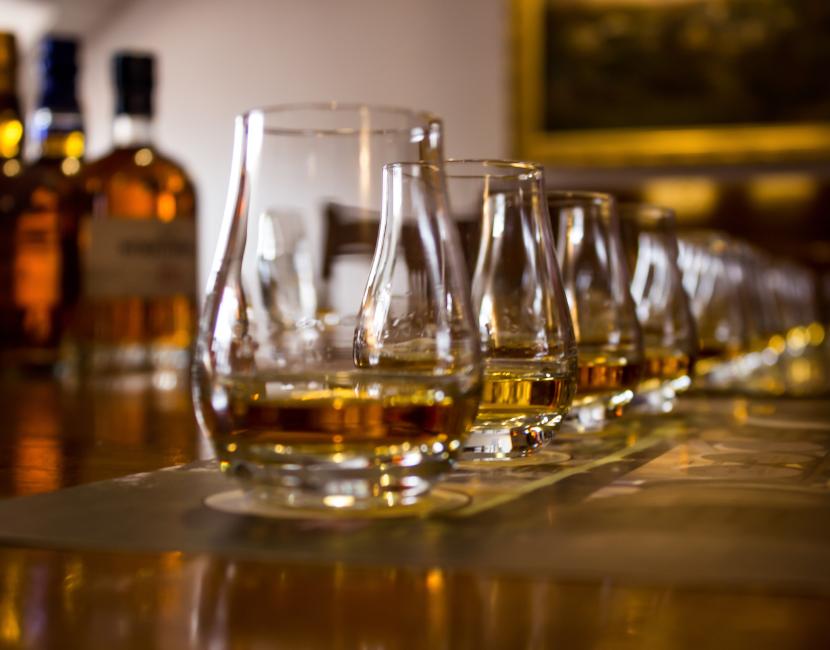 Whisky tasting flight in traditional Scottish nosing glasses at a Scotland distillery