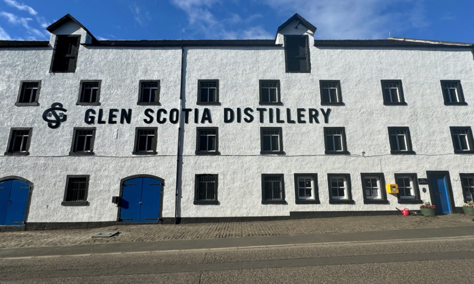 Glen Scotia Distillery's whitewashed facade in Campbeltown, Scotland