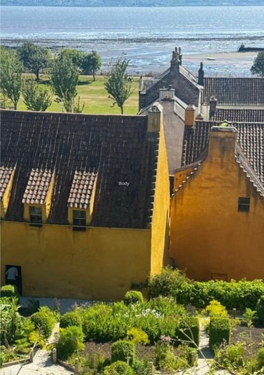 The ochre-walled Culross Palace and its terraced garden, overlooking the Firth of Forth