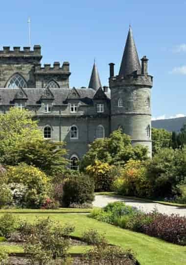 Inveraray Castle's turreted exterior and gardens beside Loch Fyne
